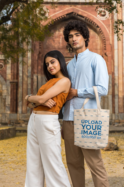 Tote Bag Mockup Featuring a Cute Couple Posing Together 