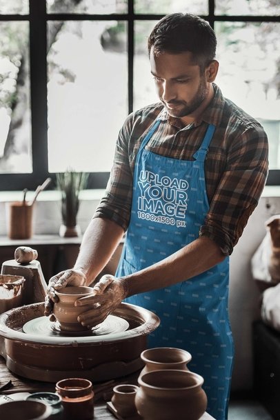 Apron Mockup of a Serious Man Working Ceramic Pottery