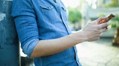 Flyer Video Glued To A Street Pole With A Guy That Looks at It