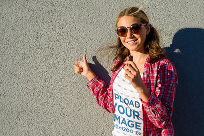 Tank Top Mockup of a Girl Wearing a Flannel Shirt While Eating Chocolate