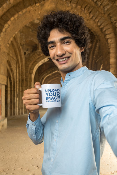11 oz Mug Mockup of a Man with Curly Hair Taking a Selfie