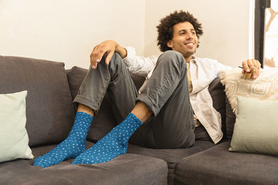 Mockup of a Man Wearing Socks While Holding a Smoking Pipe m25426