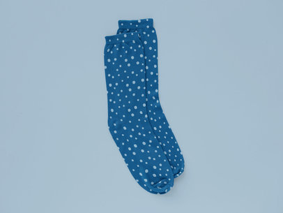 Socks Mockup Featuring a Solid Color Background 