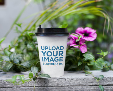 Coffee Cup Mockup Featuring a Little Flower