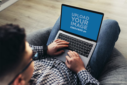 MacBook Mockup Featuring a Man Working Remotely m16685-r-el2
