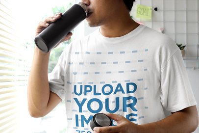 Mockup of a Man in a Round-Neck Tee Drinking from a Bottle M25559-r-el2