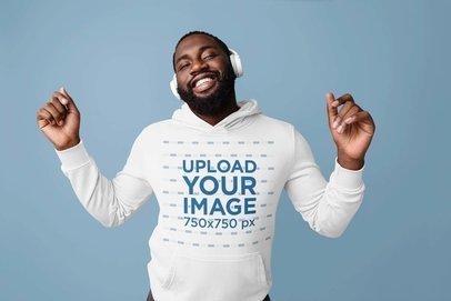 Hoodie Mockup of a Happy Bearded Man Listening to a Happy Song on His Headphones