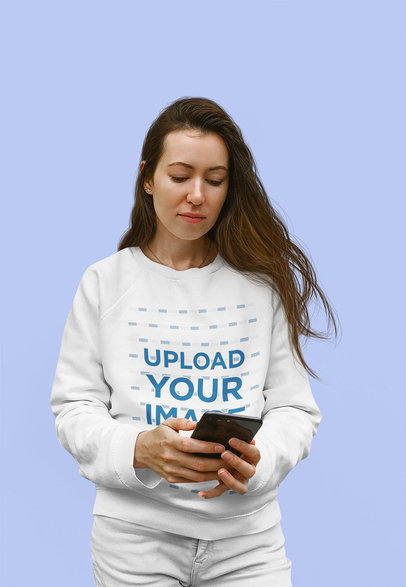 Sweatshirt Mockup Featuring a Woman With Long Hair Checking Her Phone