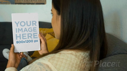 Over Shoulder Video of a Pretty Woman Taking a Look at a Book