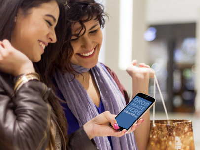 Two Friends Smiling, Using Samsung Galaxy S5 Mockup At The Mall