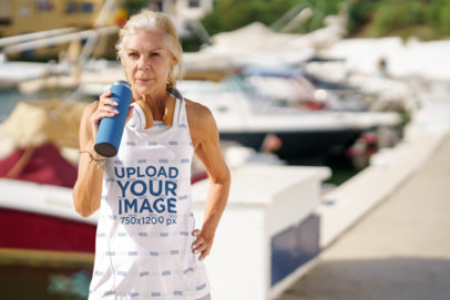 Tank Top Mockup of a Senior Woman Drinking Water After a Run