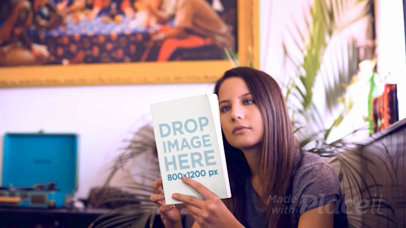 Beautiful Woman Reading a Book Video Synopsis While in her Living Room