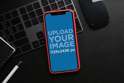 Mockup of an iPhone 13 With a Red Case