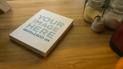 Video of a Book Lying on a Kitchen Wooden Table