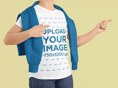 Round-Neck Tee Mockup of a Man in a Studio Pointing with His Fingers