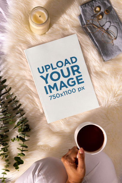 Book Mockup Featuring an Aesthetic Setting with Coffee and a Candle M26946