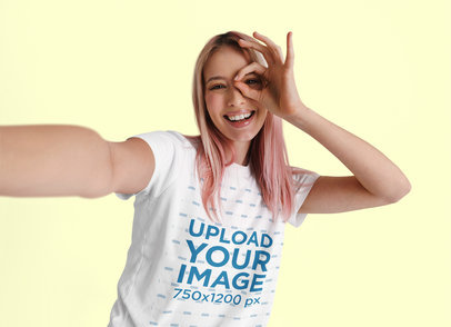 T-Shirt Mockup of a PInk-Haired Woman Making a Funny Expression