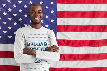 Patriotic Long Sleeve Tee Mockup of a Happy Man Posing in Front of a Flag M25963-r-el2
