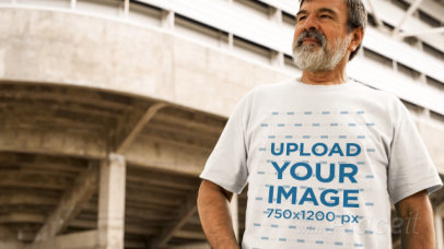 Man with a Beard Wearing a Round Neck Tee Video Outside a Stadium