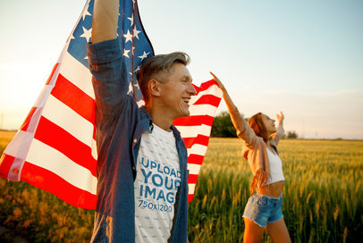 T-Shirt Mockup Featuring a Man Holding the American Flag