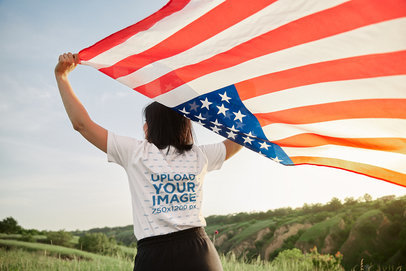 Back-View T-Shirt Mockup of a Woman Celebrating the 4th of July