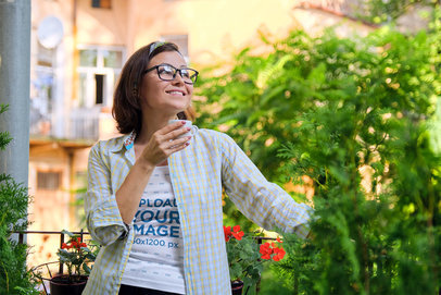 Tank Top Mockup of a Smiling Woman With a Tea Cup