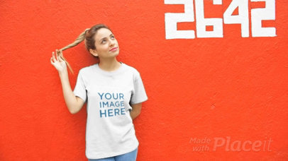 Smiling Woman Wearing a T-Shirt Video Playing with her Hair