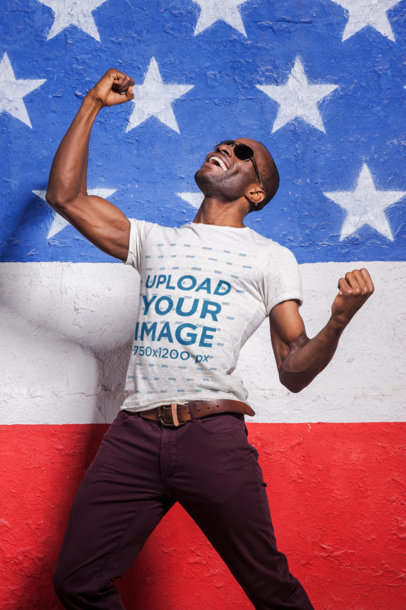 T-Shirt Mockup of a Joyful Man Celebrating the 4th of July in a Powerful Pose