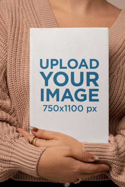 Mockup of a Woman with Long Nails Holding a Book m26947