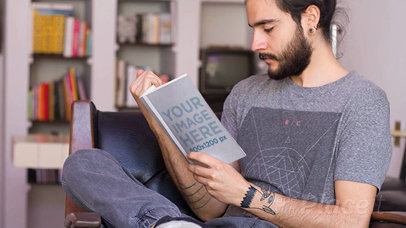 Young Hipster Dude Reading a Book in Stop Motion While on His Armchair Falling Asleep a13828