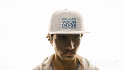 White Guy with Mustache Wearing a Snapback Hat Video Against a Shiny a14168