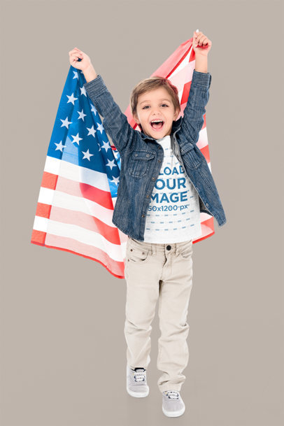 T-Shirt Mockup of a Happy Little Boy Holding an American Flag