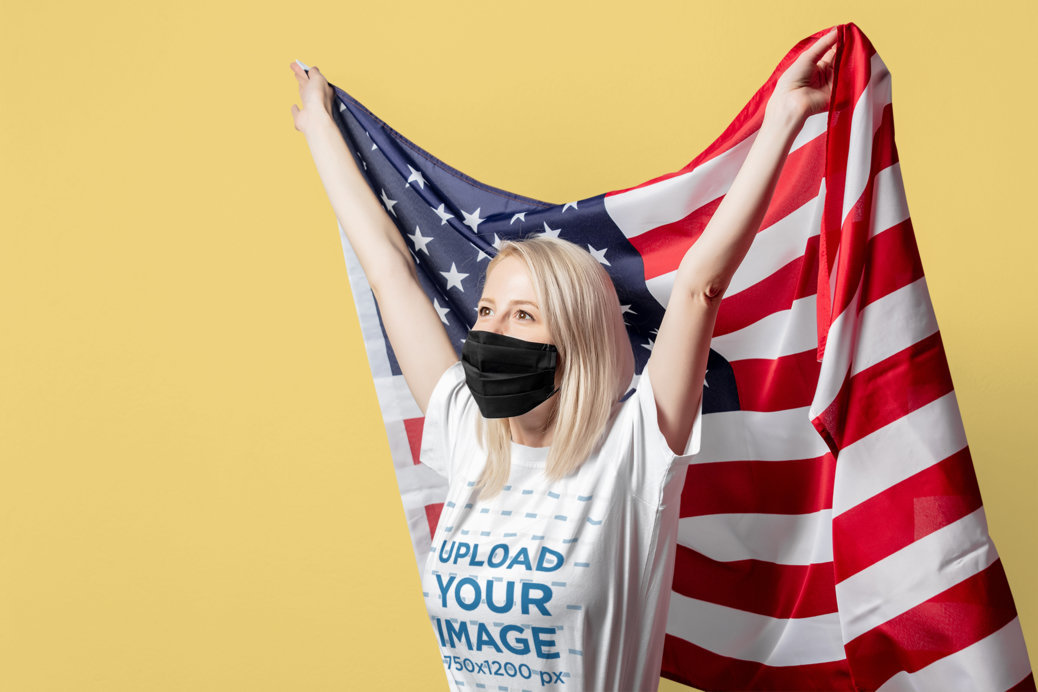 T-Shirt Mockup of a Patriotic Blonde Woman Holding an American Flag