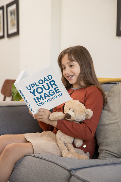 Book Mockup of a Little Girl Reading At Home