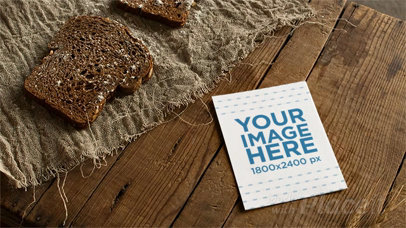 Stop Motion of a Flyer Lying on a Wooden Table While a Wheat Leaf Passes By