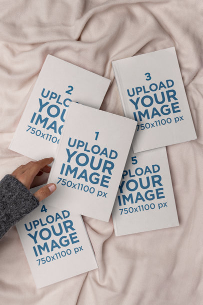 Mockup Featuring Five Books Lying on a Bed m26962
