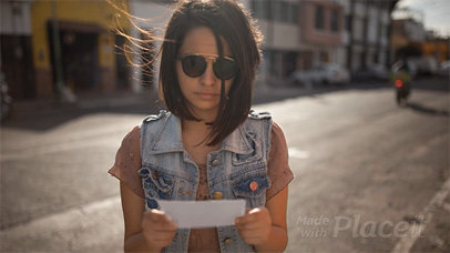 Young Trendy Woman Showing You a Flyer in Stop Motion While on the Street