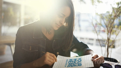 Woman Sitting Down Shows You a Flyer in Stop Motion