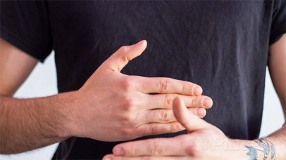 Man Making a Business Card Appear Magically in Stop Motion