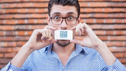 Young Dude Being Funny While Holding a Business Card in Stop Motion