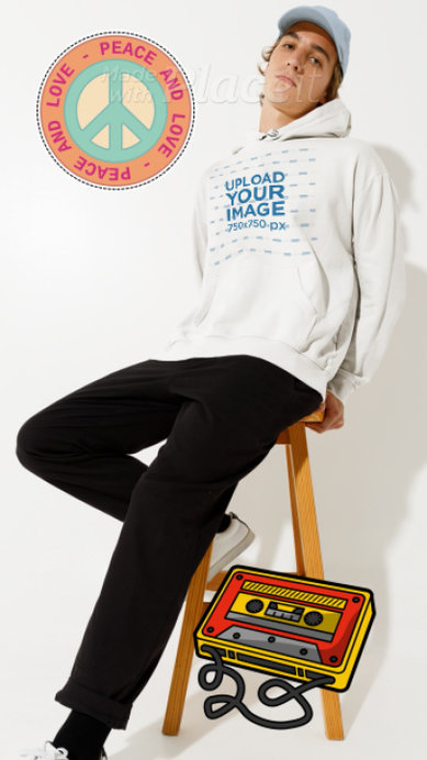 Hoodie Video of a Young Man Sitting on a Stool Featuring Animated Stickers and Musical Notes 