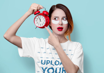 T-Shirt Mockup of a Woman with Under-Eye Patches Pointing to an Alarm Clock m22941 r-el2