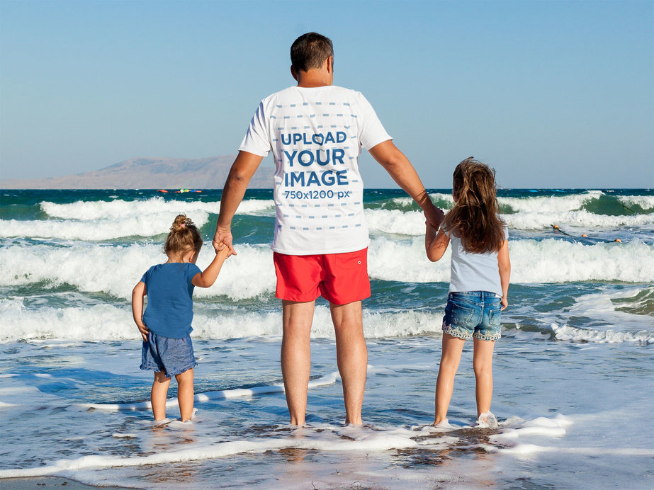 T-Shirt Mockup of a Father at The Beach With His Daughters