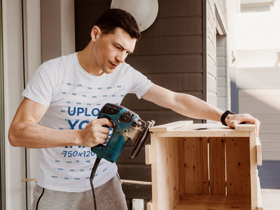 T-Shirt Mockup Featuring a Man Building a Wood Box m7463-r-el2
