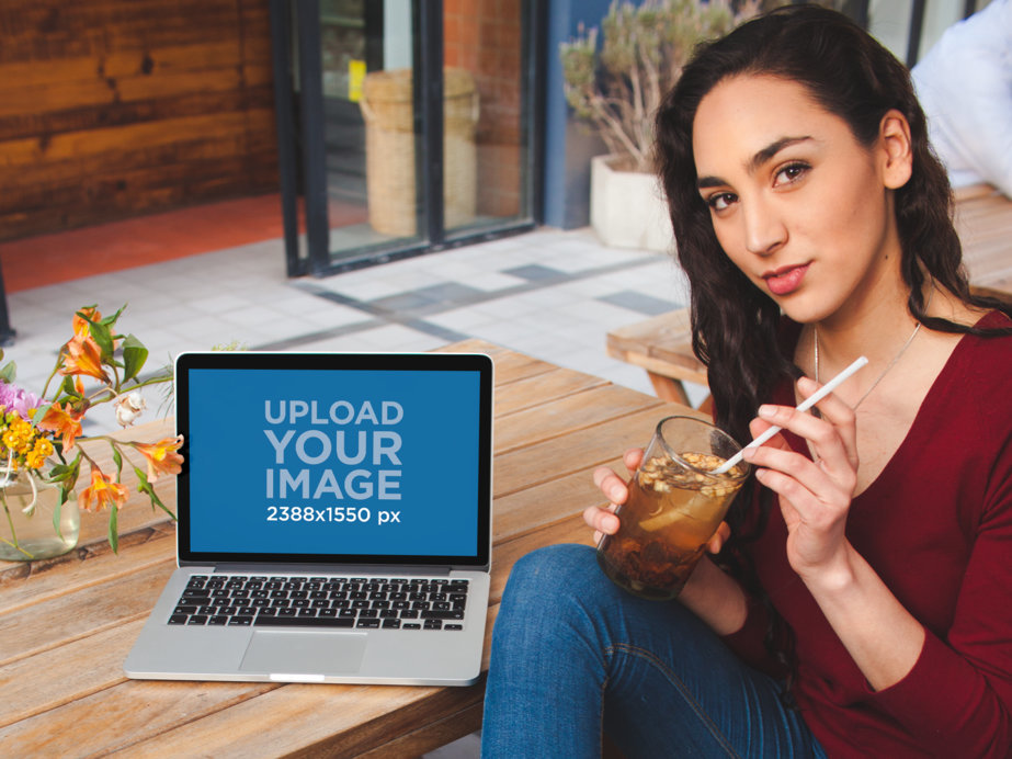 MacBook Mockup Featuring a Pretty Woman Drinking Iced Tea