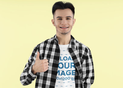 Rounded-Neck Tee Mockup of a Smiling Man with Giving a Thumb-Up