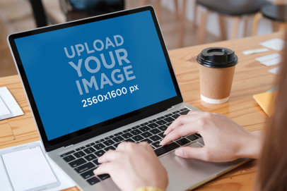 MacBook Mockup of a Woman Working 