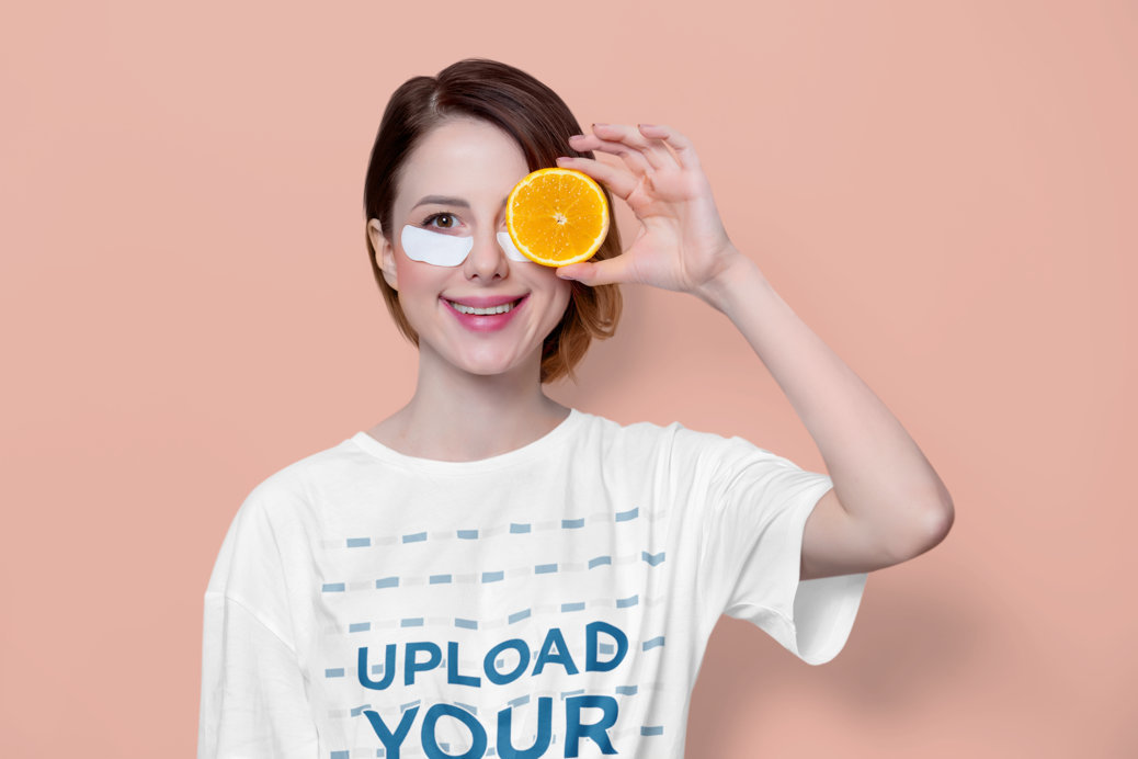 T-Shirt Mockup Featuring a Woman Orange-Infused Eye Bag Patches