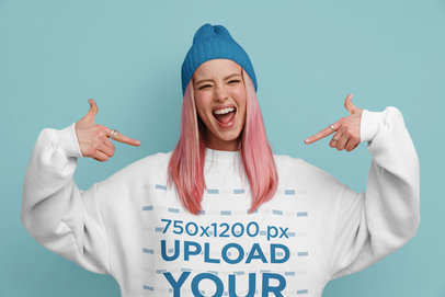 Mockup of a Woman with Pink-Dyed Hair Pointing at Her Sweatshirt