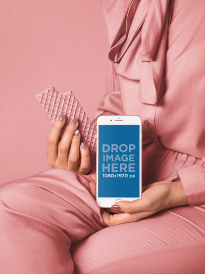iPhone 8 Mockup of a Woman in Millennial Pink Setting